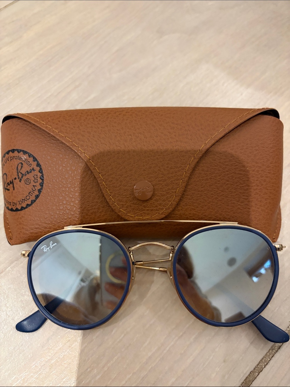Ray-Ban Round Sunglasses with Blue Frames and Gold Bridge